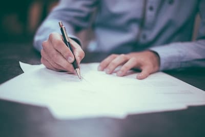 Professional reviewing documents, symbolizing efficient case management with SpineLegal Software.