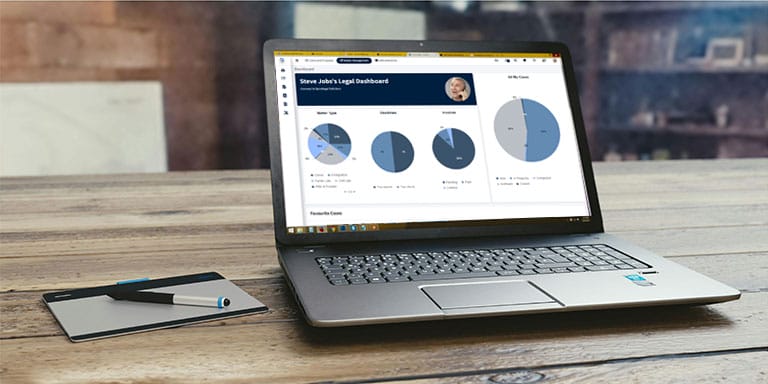 Laptop displaying SpineLegal Software dashboard on a desk, illustrating efficient legal management tools.