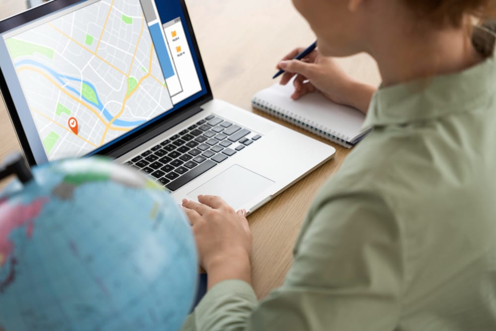 Person using SpineLegal software on a laptop for efficient legal case management and location analysis.