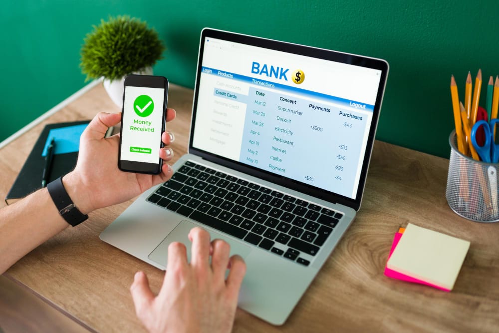 Managing finances seamlessly with SpineLegal Software on phone and laptop, enhancing productivity and efficiency.